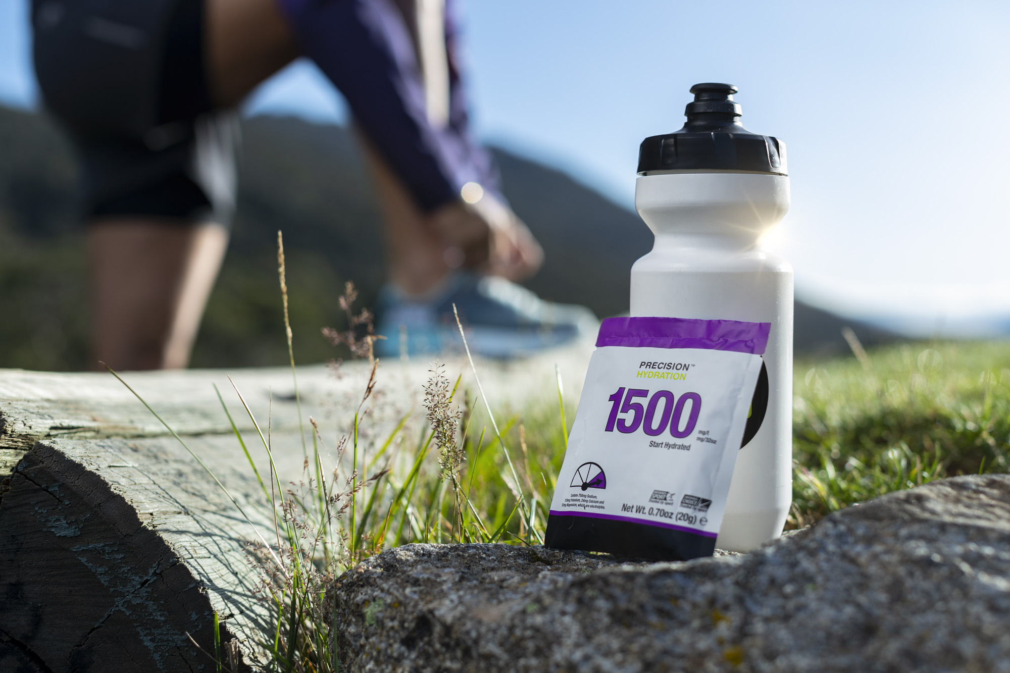 PH 1500 packet and bottle with Sarah lacing up shoes in background